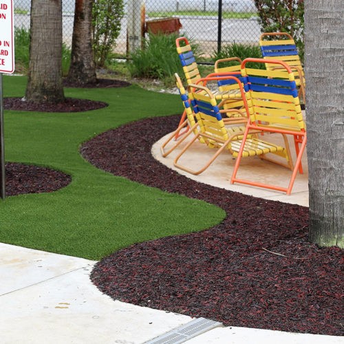 artificial grass and rubber mulch used in miami public pool