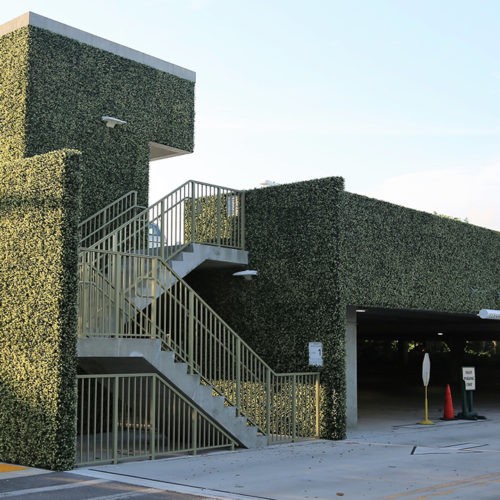 artificial ivy used as green wall and artificial living wall on parking garage